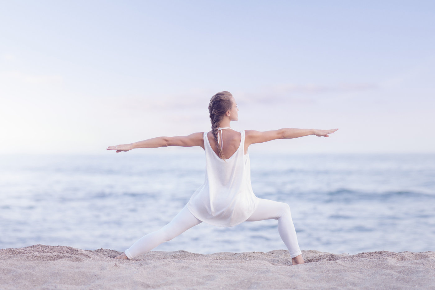 a woman in white exercising