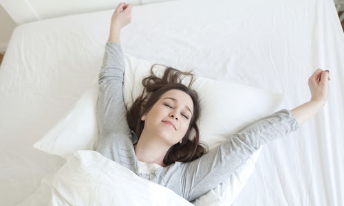 woman relaxing on the bed