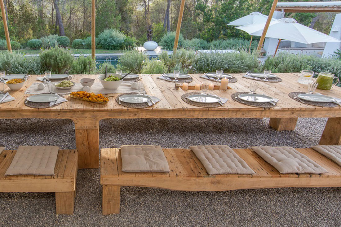 a dining table with several plates and some food